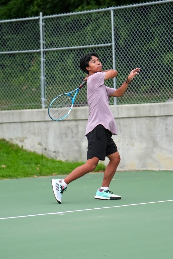 David playing tennis